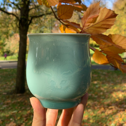 Traditional Chinese Celadon Cup with Hand Carved Cat Pattern